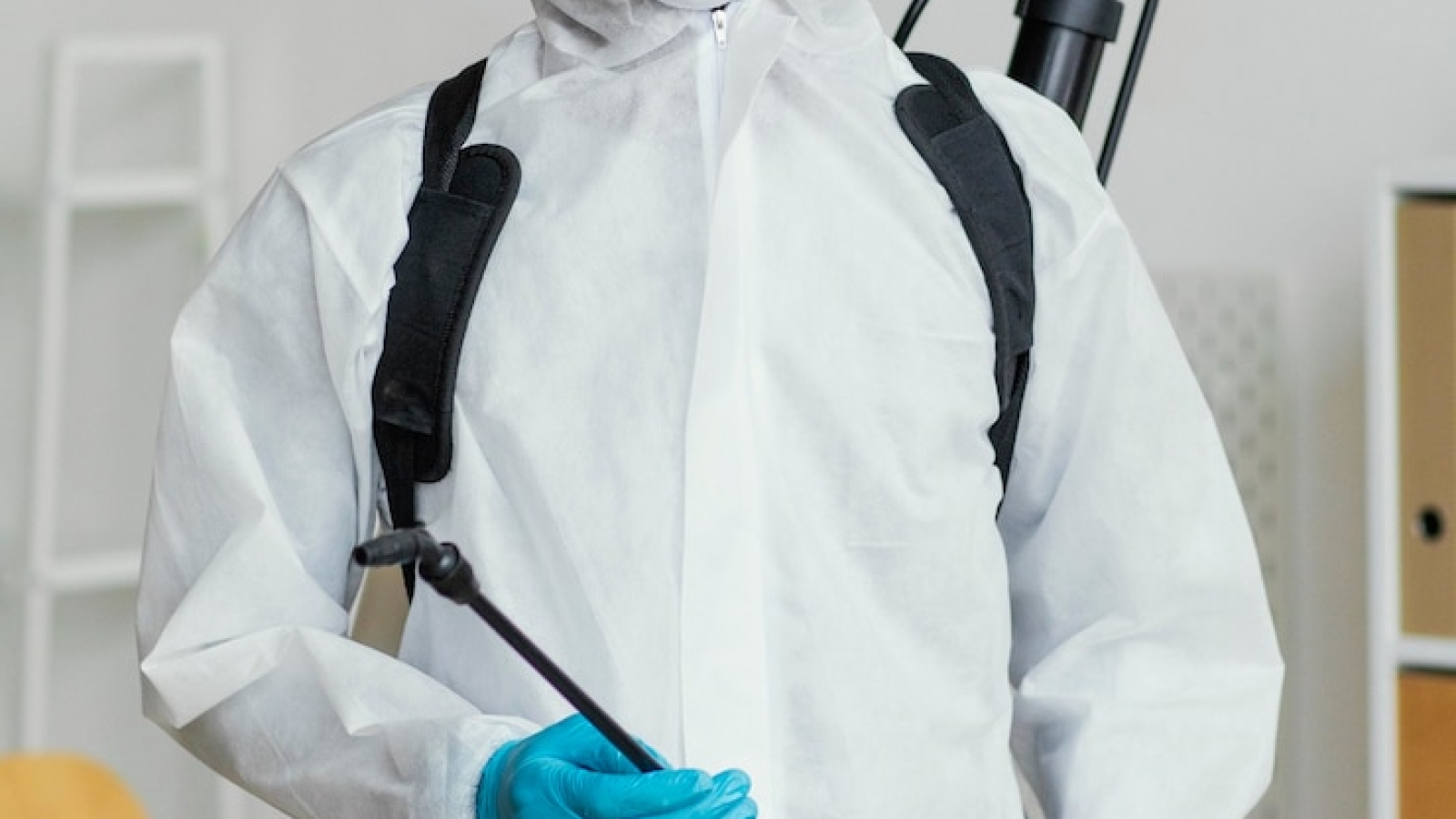 person-protective-suit-getting-ready-disinfect-room_23-2148848559